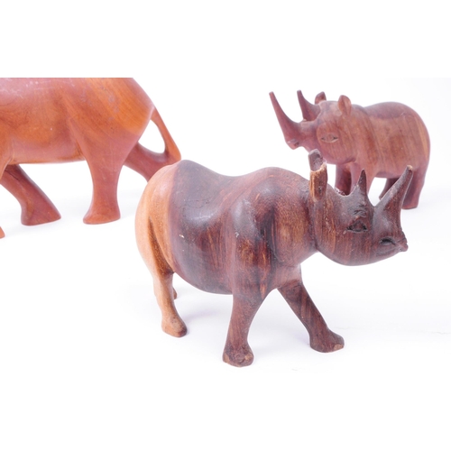 341 - A collection of vintage 20th century carved treen wooden Rhinos with one hippopotamus figures. All i... 