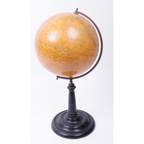 347 - 20th century desktop world globe with brass arm and ebonised turned wooden stand. Makers sticker tit... 