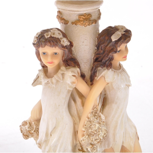 353 - Two 20th century resin table lamps, comprised of an Academy lamp decorated with three flower fairy f... 