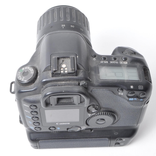 356 - Canon - A vintage circa 2003 Canon EOS 10D digital SLR camera. The camera in black colourway, with C... 