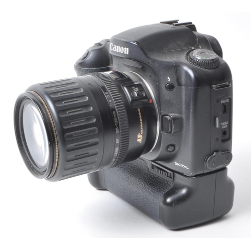 356 - Canon - A vintage circa 2003 Canon EOS 10D digital SLR camera. The camera in black colourway, with C... 