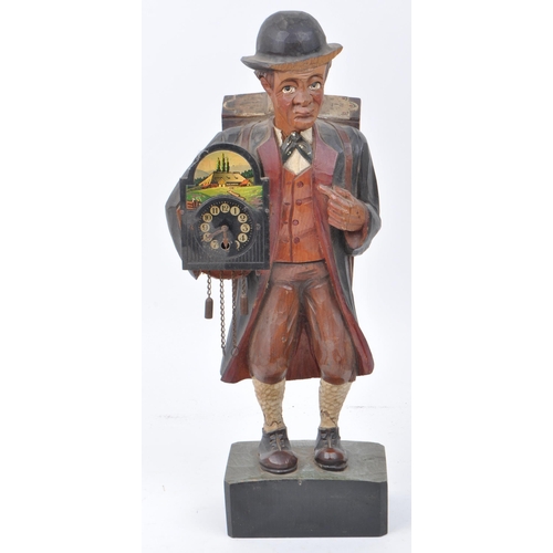 382 - An early 20th century circa 1940s Black Forest hand carved Whistler cuckoo clock figure. Gentleman h... 