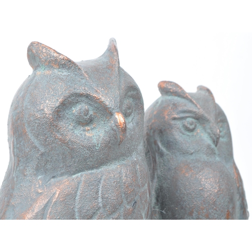 388 - 20th century cast copper owl sculpture depicting two owls sitting on a branch. Makers unknown. Measu... 