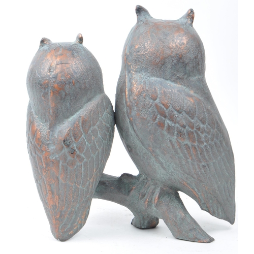 388 - 20th century cast copper owl sculpture depicting two owls sitting on a branch. Makers unknown. Measu... 