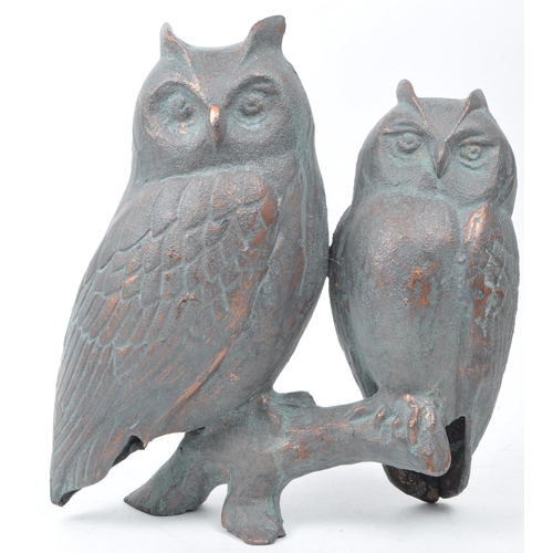 388 - 20th century cast copper owl sculpture depicting two owls sitting on a branch. Makers unknown. Measu... 