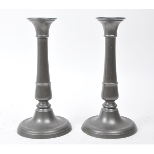 389 - 20th century pewter and brass candlestick holders and wall decor, comprised of two pewter candlestic... 