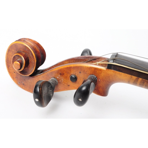 407 - An early 20th century mahogany violin. The violin having ebonised fingerboard and chinrest.