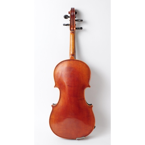 407 - An early 20th century mahogany violin. The violin having ebonised fingerboard and chinrest.