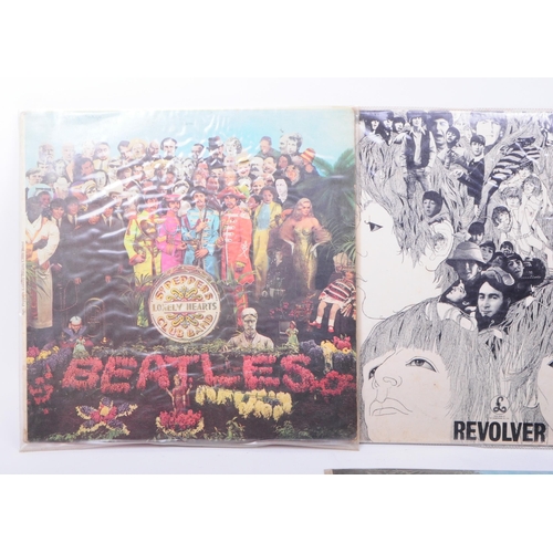 411 - The Beatles - Six late 20th century LP vinyl records. Comprised of Abbey Road PCS 7088 -2/-1, A Hard... 