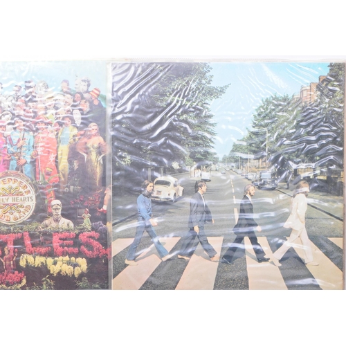 411 - The Beatles - Six late 20th century LP vinyl records. Comprised of Abbey Road PCS 7088 -2/-1, A Hard... 