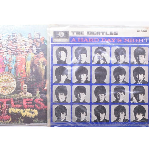 411 - The Beatles - Six late 20th century LP vinyl records. Comprised of Abbey Road PCS 7088 -2/-1, A Hard... 