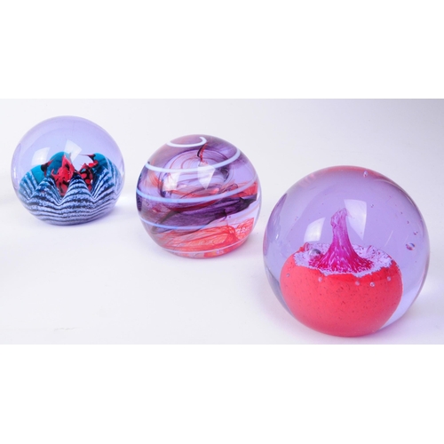 42 - Caithness - Collection of eight late 20th century glass paperweights. Comprised of Desert Spring, Po... 