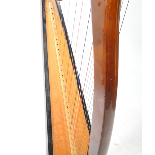 420 - Aoyama - A vintage 20th century Aoyama Japanese walnut cased floor harp. Having a shaped base. Featu... 