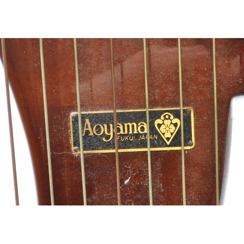 420 - Aoyama - A vintage 20th century Aoyama Japanese walnut cased floor harp. Having a shaped base. Featu... 