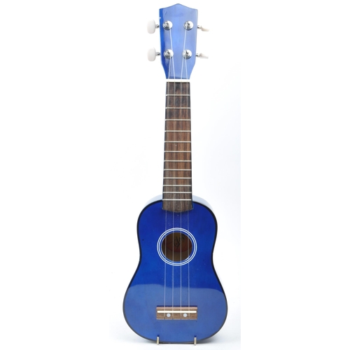 429 - Tanglewood ukulele string musical instrument. Together with an electric blue Lazy ukulele. Model num... 