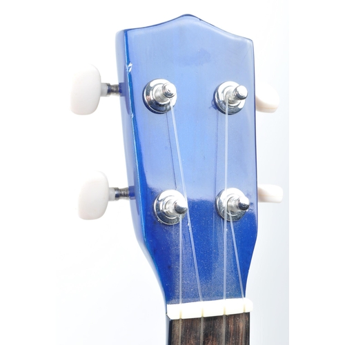 429 - Tanglewood ukulele string musical instrument. Together with an electric blue Lazy ukulele. Model num... 