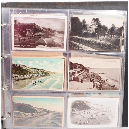 487 - A collection of early and mid 20th century British Holiday postcards. The collection features a larg... 