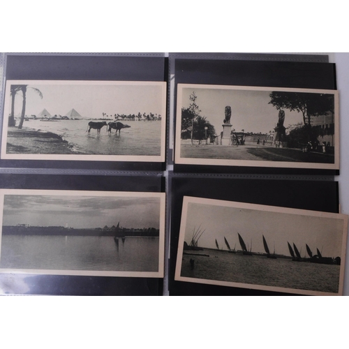 517 - Collection of early 20th century Egypt photographic postcards, including black and white, and hand c... 