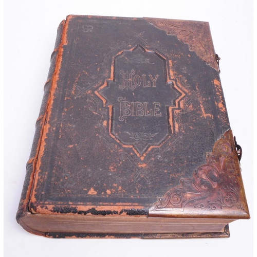 520 - Large Victorian family holy bible with leather cover and brass clasps and corners. Measuring approx.... 