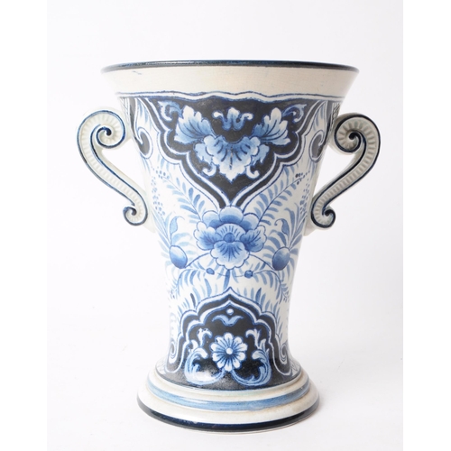 63 - Villeroy & Boch - Early 20th century ceramic twin handled delft style vase. Featuring a black an... 