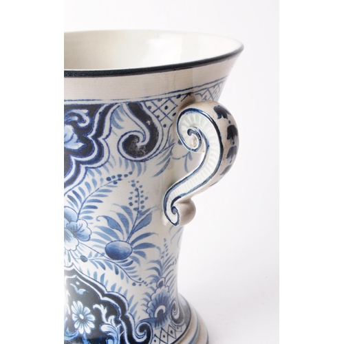 63 - Villeroy & Boch - Early 20th century ceramic twin handled delft style vase. Featuring a black an... 