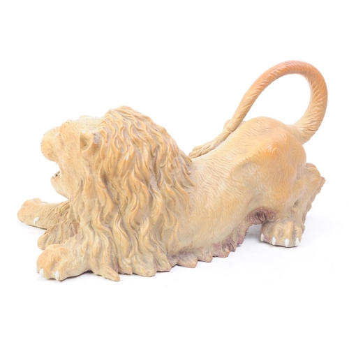 66 - A mid 20th century circa 1960s Chinese Cantonese ceramic lion figure. The lion in recumbent position... 