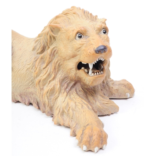 66 - A mid 20th century circa 1960s Chinese Cantonese ceramic lion figure. The lion in recumbent position... 