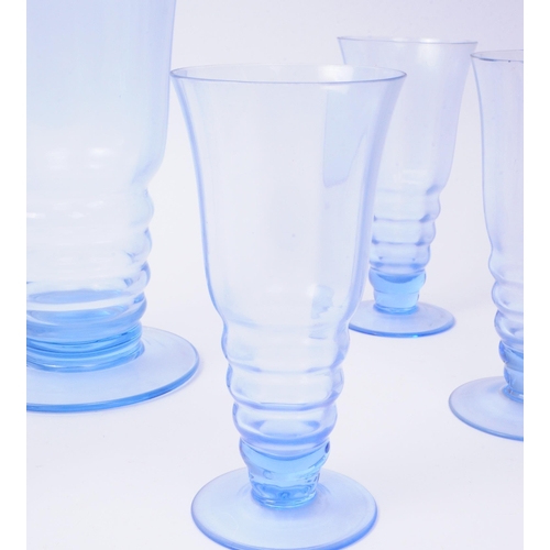 79 - A vintage mid 20th century blue glass lemonade set. To consist of six glasses, alongside a pitcher. ... 