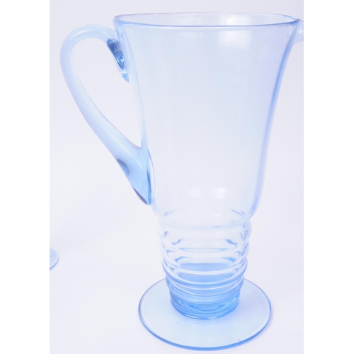 79 - A vintage mid 20th century blue glass lemonade set. To consist of six glasses, alongside a pitcher. ... 