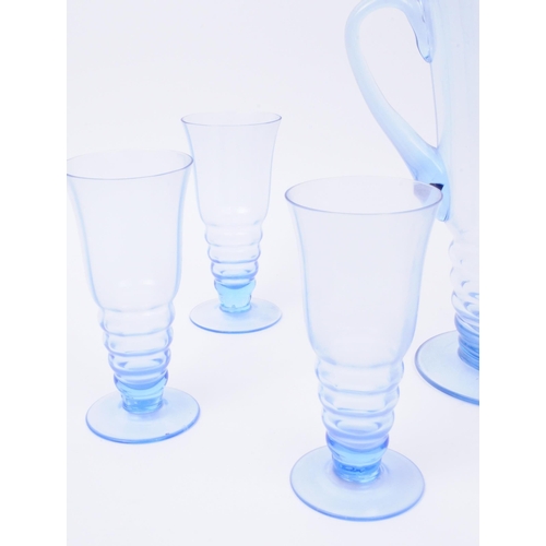 79 - A vintage mid 20th century blue glass lemonade set. To consist of six glasses, alongside a pitcher. ... 