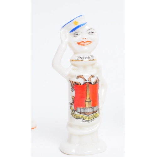 90 - A collection of four early 20th century crested china figures. Comprised of a Carlton china John Cit... 