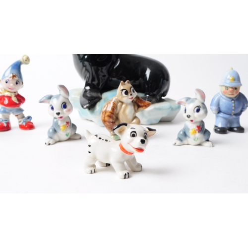 91 - Wade - Collection of 20th century pottery figurines, comprised of three noddy figures, two rabbits, ... 