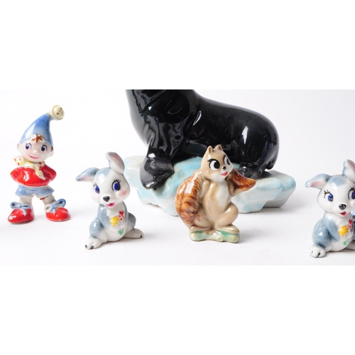 91 - Wade - Collection of 20th century pottery figurines, comprised of three noddy figures, two rabbits, ... 