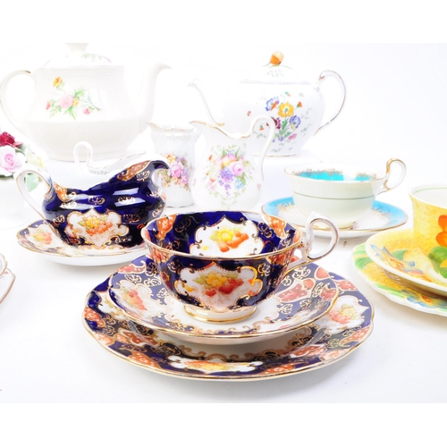 93 - Collection of 20th century bone china tea cups, teapots and more. Makers including Royal Albert, Ayn... 