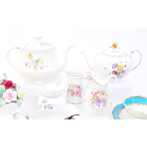 93 - Collection of 20th century bone china tea cups, teapots and more. Makers including Royal Albert, Ayn... 