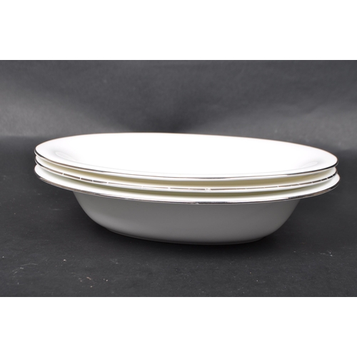 139 - Wedgwood - A vintage 20th century Wedgwood Signet Platinum bone china part dinner service, alongside... 