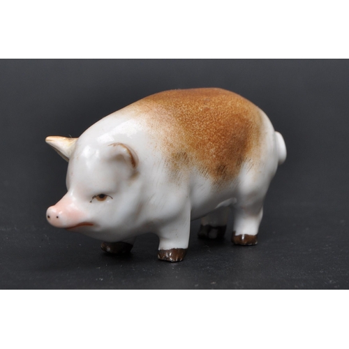 187 - Collection of five 20th century porcelain pig figurines from various makers. Comprised of a Belleek ... 