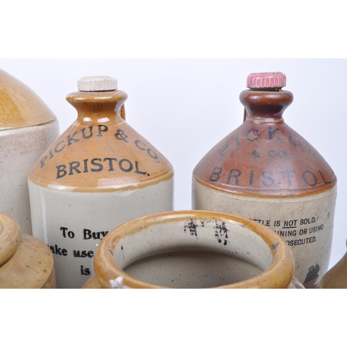 192 - Collection of local interest stoneware flagons jugs. Two tone colourway with carry handle, text to f... 