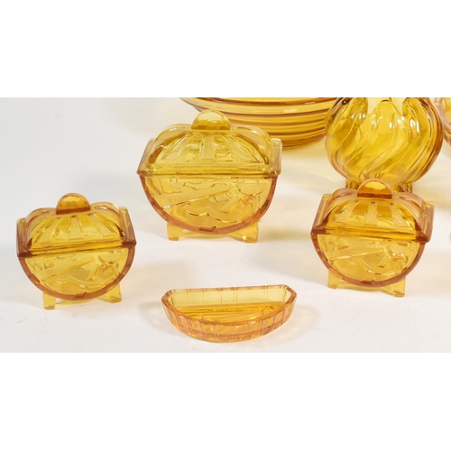 32 - Collection of mid century amber glass dressing table set pieces. Comprised of a centrepiece bowl, ca... 