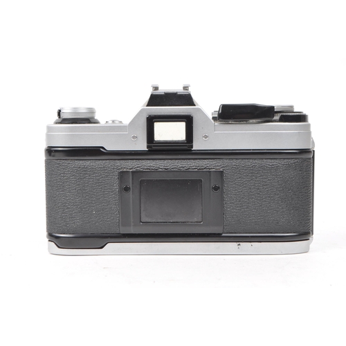 370 - Canon - A vintage 20th century circa 1980s Canon AE-1 35mm SLR camera. The camera in silver colourwa... 