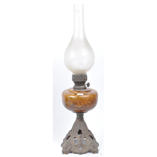 377 - A collection of Victorian and later table top oil lamps. Brass and copper construction with an iron ... 