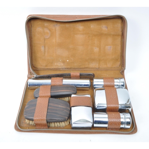 399 - A large collection of vintage 20th century travelling case vanity sets. Seven in total in the brown ... 