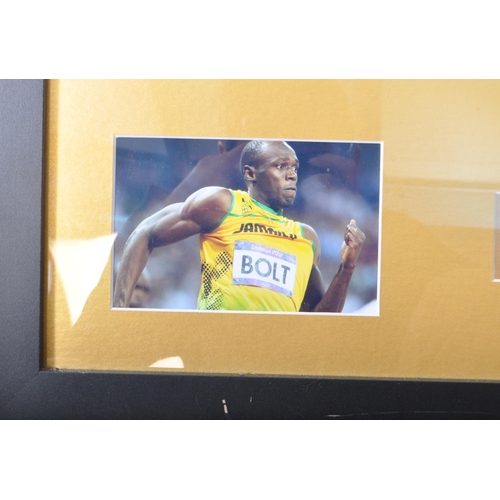 436 - Usain Bolt - A contemporary signed framed piece of artwork. With a silhouette of the athlete in his ... 