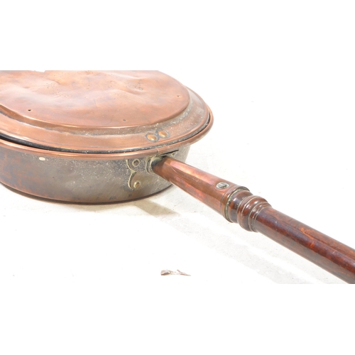 441 - Victorian 19th century copper bed pan. Features hinged lid and wooden turned handle. Measuring appro... 