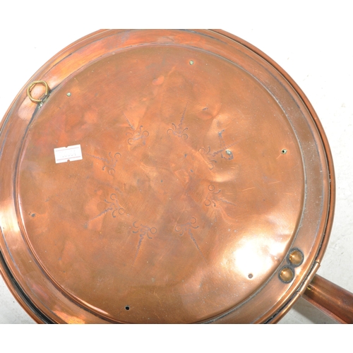 441 - Victorian 19th century copper bed pan. Features hinged lid and wooden turned handle. Measuring appro... 