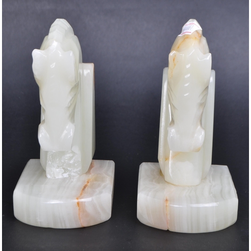 454 - Pair mid century horse onyx book ends. Rectangular plinth base with horse bust to top AF.(13cm heigh... 