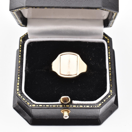 104 - A hallmarked 9ct gold Masonic flip ring. The yellow gold signet ring having a reversible square head... 