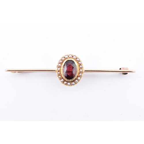 107 - A 15ct gold, garnet and pearl brooch pin. The 15ct yellow gold brooch pin set with a central collet ... 