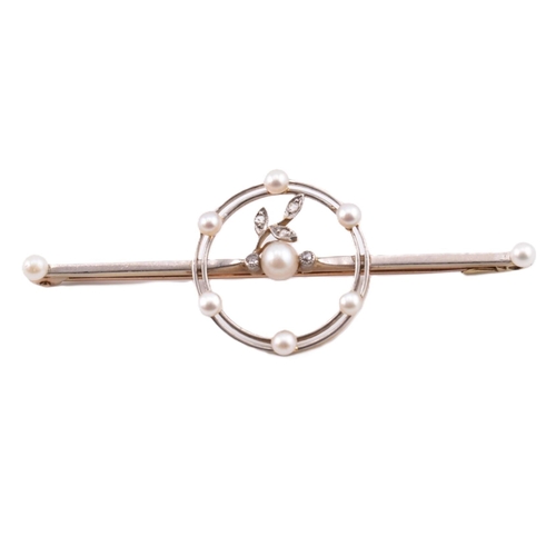 115 - A 15ct gold platinum, pearl and diamond brooch pin. The 15ct gold brooch pin set with a central pear... 