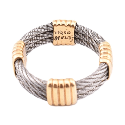 116 - An 18ct gold and steel Force 10 ring. The ring formed from three rows of stainless steel cable with ... 